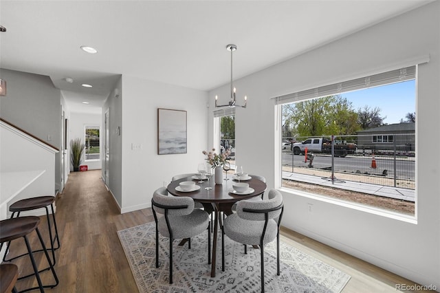1335 N Alton St, Aurora, CO 80010 - dining room featuring wood finished floors, a chandelier, and recessed lighting