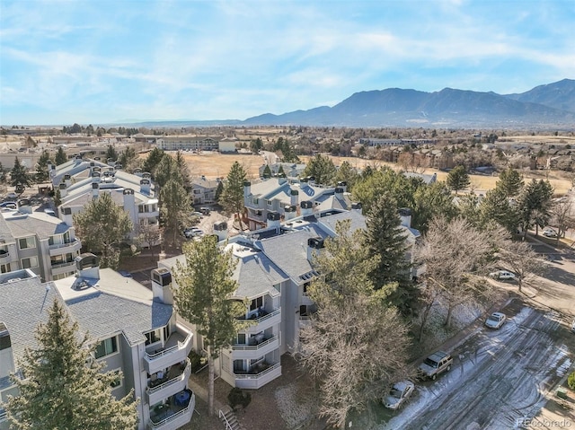 birds eye view of property featuring a mountain view