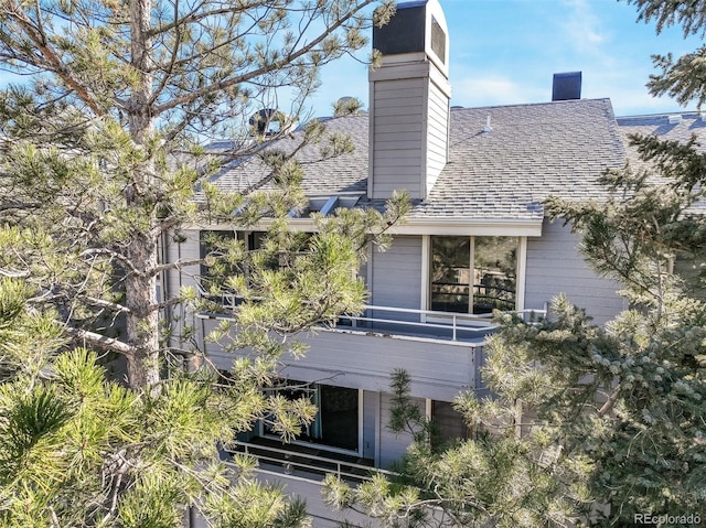 rear view of house with a balcony