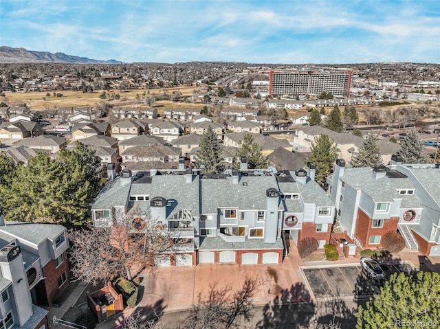 birds eye view of property with a mountain view