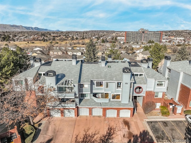 birds eye view of property with a mountain view