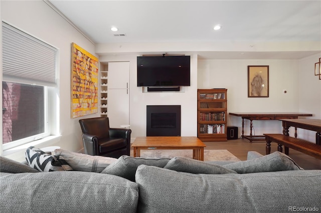 living room featuring crown molding