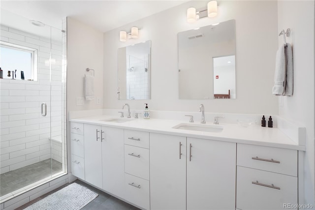 bathroom with vanity, walk in shower, and tile patterned floors