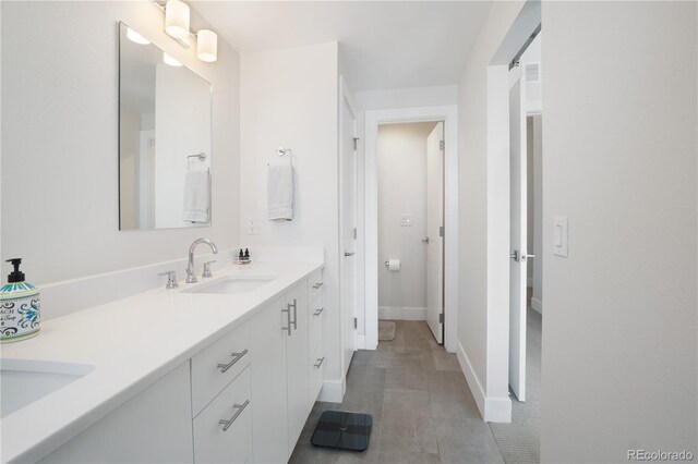 bathroom with vanity and tile patterned floors