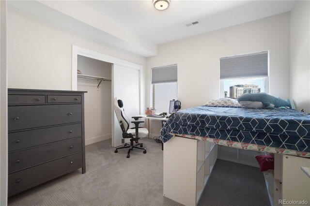 carpeted bedroom featuring a closet