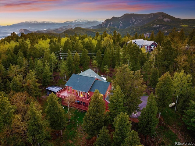 11163 Conifer Mountain Rd, Conifer, CO 80433 - aerial view at dusk of a mountain view and a view of trees