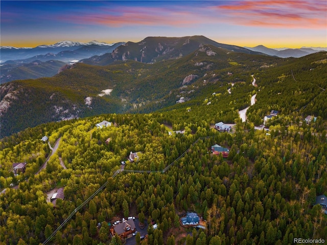 11163 Conifer Mountain Rd, Conifer, CO 80433 - aerial view of property and surrounding area featuring mountains and a heavily wooded area