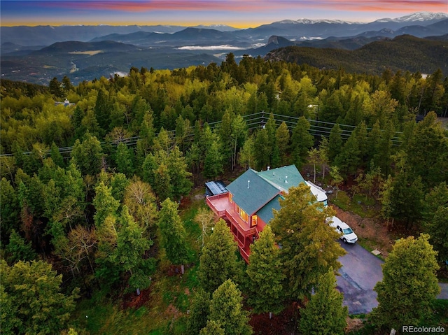 11163 Conifer Mountain Rd, Conifer, CO 80433 - aerial view at dusk of a mountain view and a view of trees