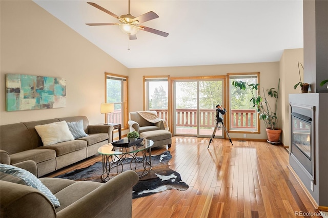 11163 Conifer Mountain Rd, Conifer, CO 80433 - living area featuring vaulted ceiling, ceiling fan, and light wood-type flooring