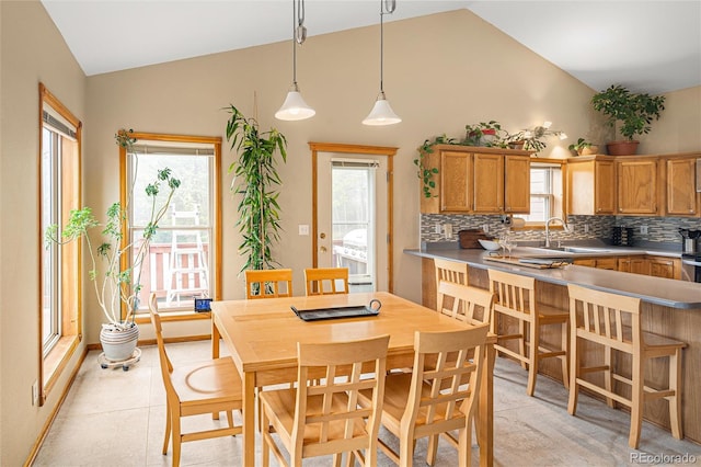 11163 Conifer Mountain Rd, Conifer, CO 80433 - dining space with plenty of natural light and high vaulted ceiling