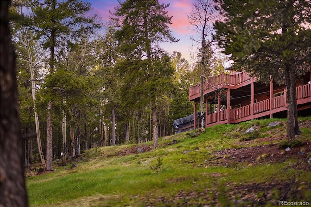 11163 Conifer Mountain Rd, Conifer, CO 80433 - yard at dusk featuring a wooden deck