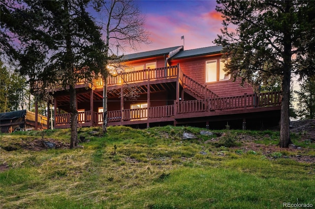 11163 Conifer Mountain Rd, Conifer, CO 80433 - rear view of property with a deck and stairway