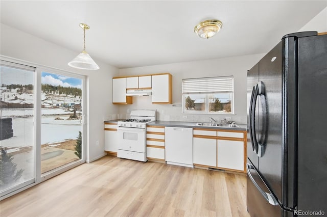 109 Gcr 823, Tabernash, CO 80478 - kitchen with white appliances, under cabinet range hood, a sink, and light wood-type flooring