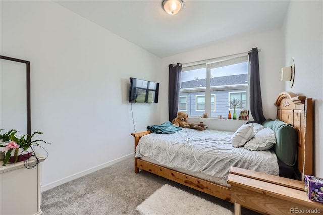 bedroom with carpet floors and baseboards