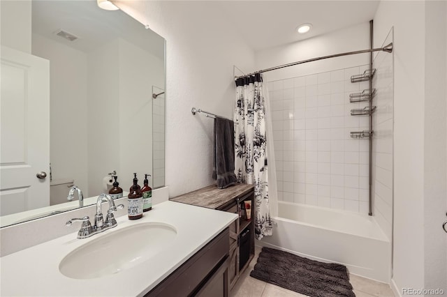 bathroom with shower / bathtub combination with curtain, vanity, visible vents, and tile patterned floors