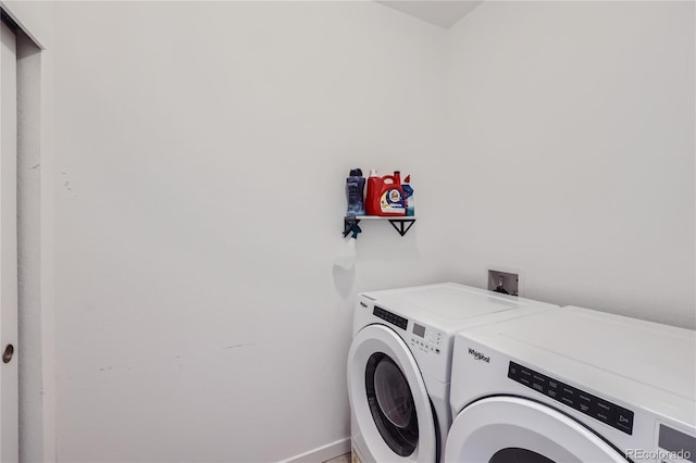 washroom with laundry area and independent washer and dryer