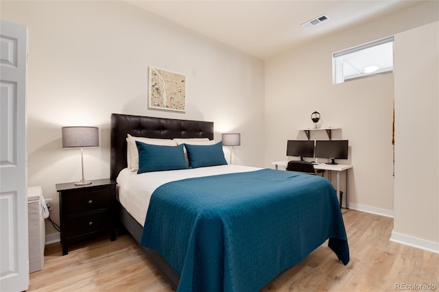 bedroom with light wood-type flooring