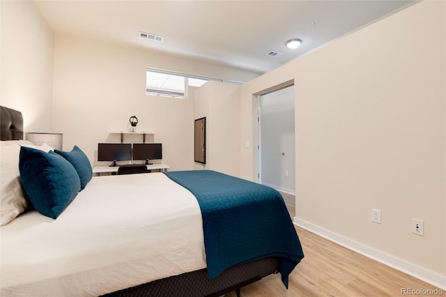 bedroom with light wood-type flooring