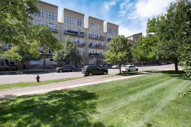 view of home's community with a lawn