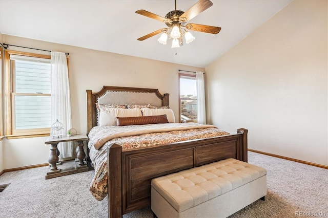 carpeted bedroom with vaulted ceiling and ceiling fan