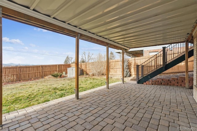 view of patio featuring a storage shed