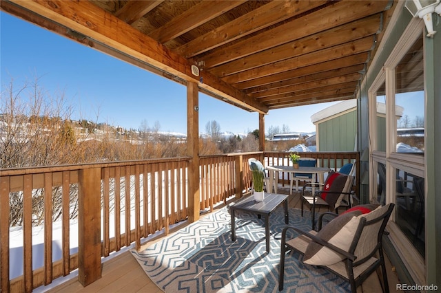 view of snow covered deck