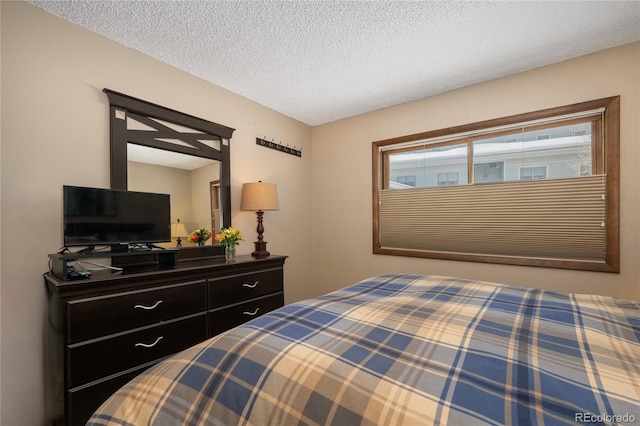 bedroom featuring a textured ceiling