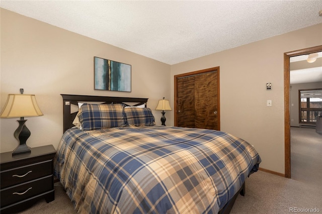 carpeted bedroom with a textured ceiling