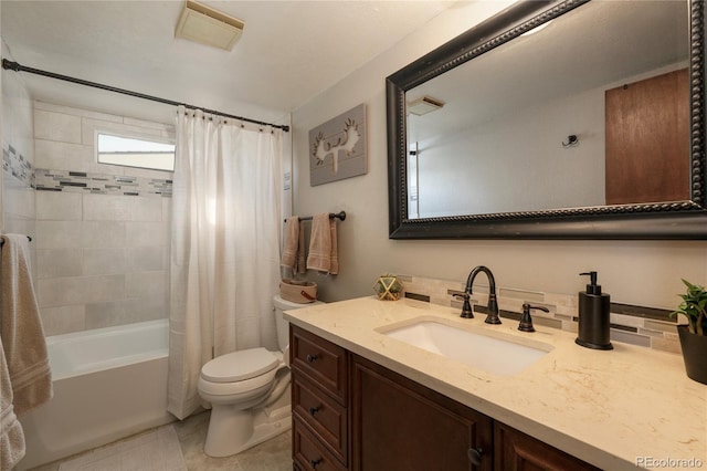 full bathroom with shower / bath combo with shower curtain, toilet, and vanity