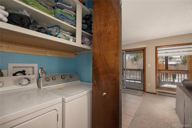 laundry area featuring a textured ceiling, light tile patterned floors, independent washer and dryer, and a baseboard radiator