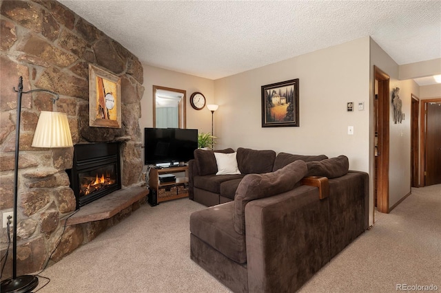 300 Sterling Way Unit 4, Fraser, CO 80442 - living room with carpet flooring, a textured ceiling, and a fireplace
