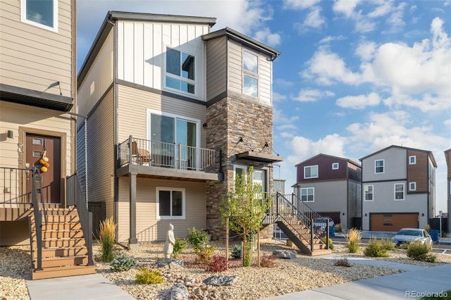 exterior space featuring a garage and a balcony