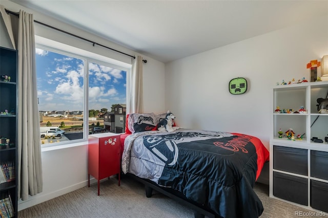 carpeted bedroom featuring multiple windows