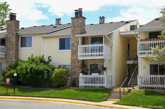 8555 Fairmount Dr Unit C202, Denver, CO 80247 - view of building exterior featuring stairs