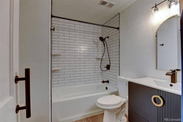 8555 Fairmount Dr Unit C202, Denver, CO 80247 - full bath with toilet, vanity, wood finished floors, and tub / shower combination