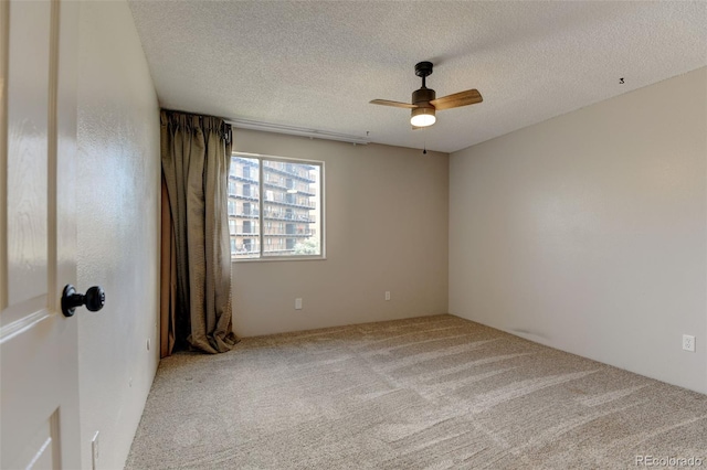 8555 Fairmount Dr Unit C202, Denver, CO 80247 - carpeted spare room featuring ceiling fan and a textured ceiling