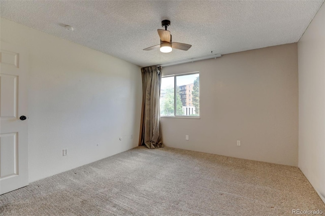 8555 Fairmount Dr Unit C202, Denver, CO 80247 - unfurnished room with carpet, ceiling fan, and a textured ceiling