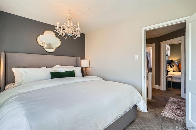 bedroom featuring a chandelier, carpet floors, and baseboards