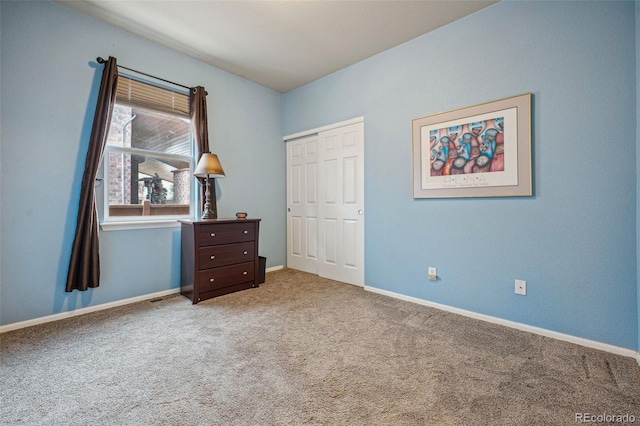 unfurnished bedroom with a closet and carpet