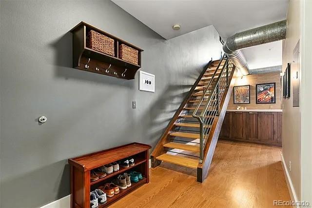 stairs with wood-type flooring