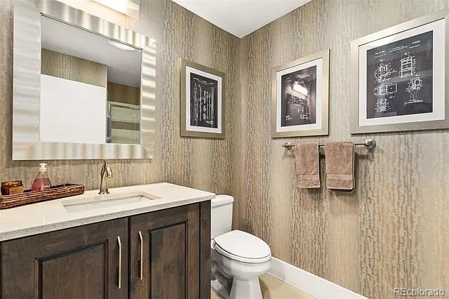 bathroom with vanity and toilet