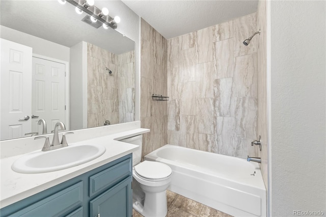 bathroom with a textured wall, toilet, tub / shower combination, vanity, and a textured ceiling