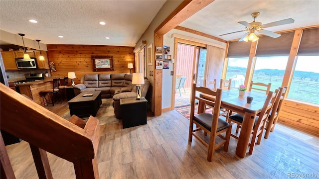 366 Gcr 4421, Grand Lake, CO 80557 - dining area with wood walls, light wood-style floors, recessed lighting, a textured ceiling, and ceiling fan