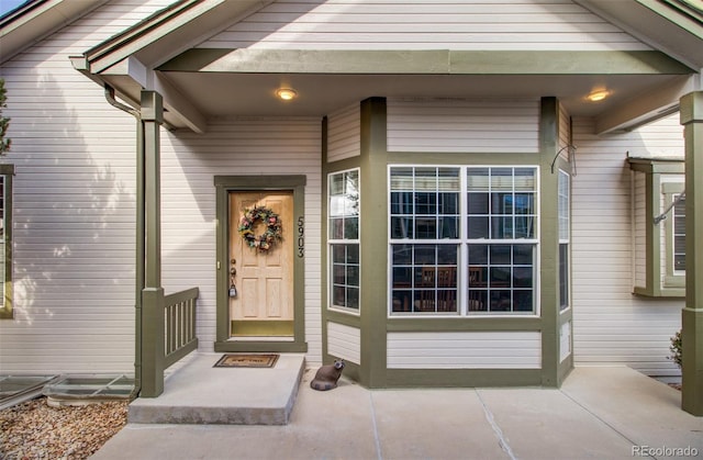 doorway to property featuring covered porch