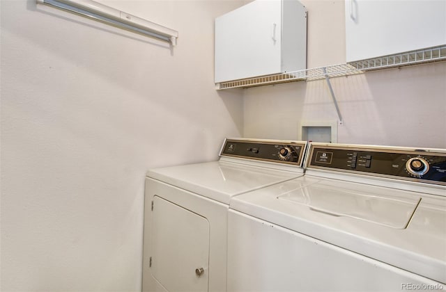 clothes washing area featuring washer and clothes dryer