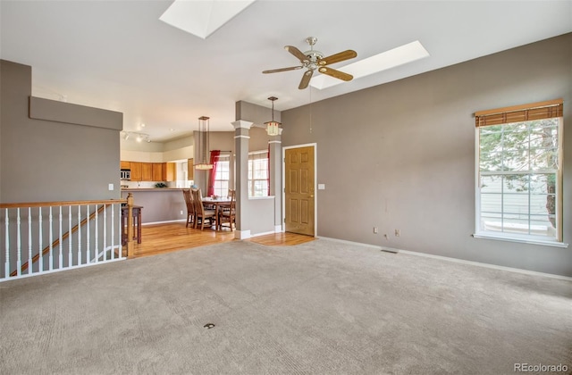 carpeted empty room featuring ceiling fan