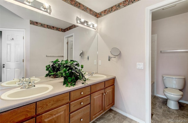 bathroom featuring vanity and toilet