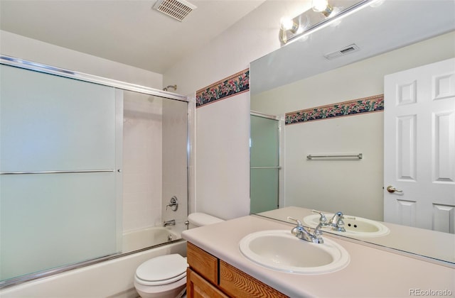 full bathroom with toilet, combined bath / shower with glass door, and vanity