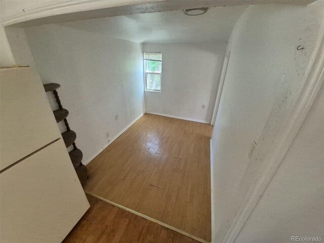 1266 Del Mar Pkwy, Aurora, CO 80010 - basement featuring wood finished floors and baseboards