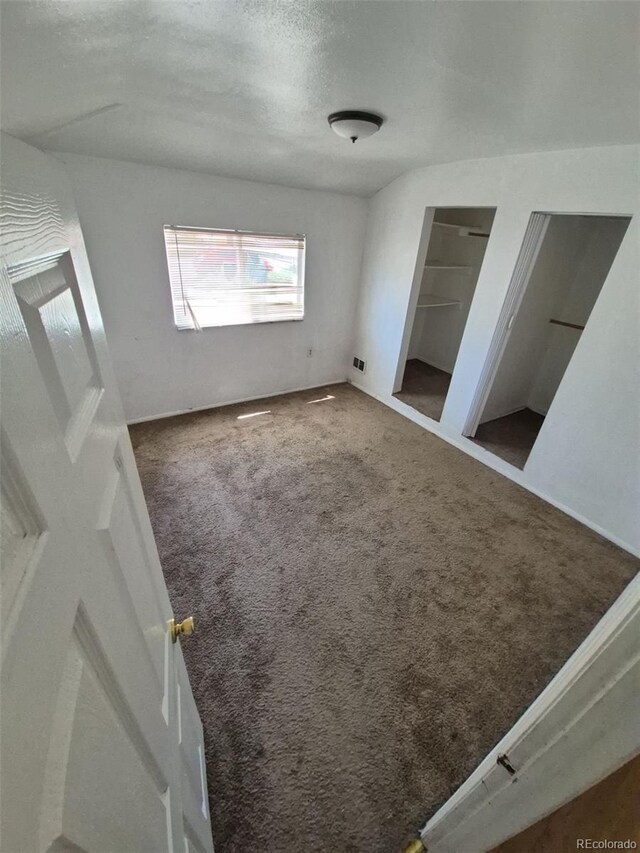 1266 Del Mar Pkwy, Aurora, CO 80010 - unfurnished bedroom featuring carpet flooring and a textured ceiling